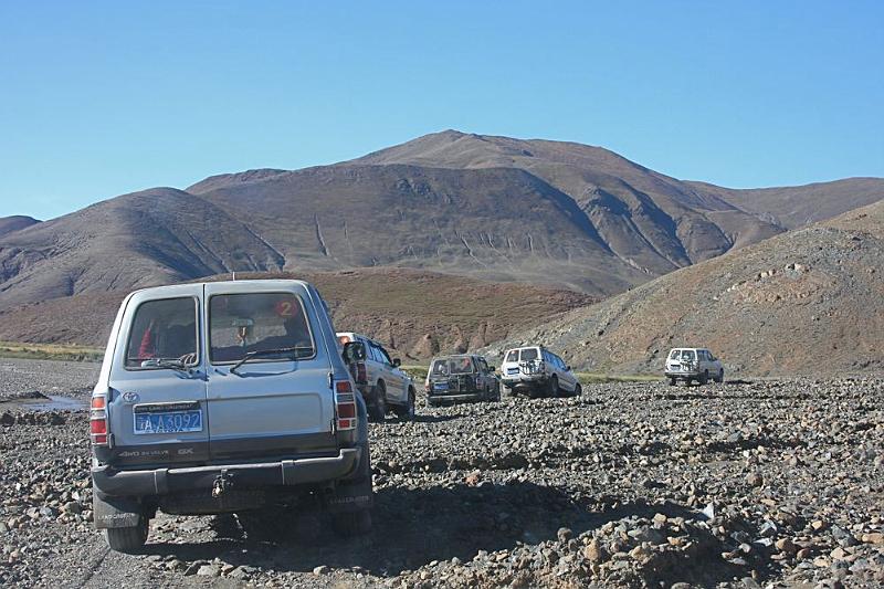 134 Landcruisers heading to the trailhead to Ngor Monastery.jpg